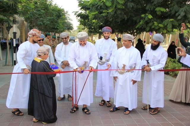 Team PACP and Ali al qalhathi cutting ribbon in starting ceremony of an event